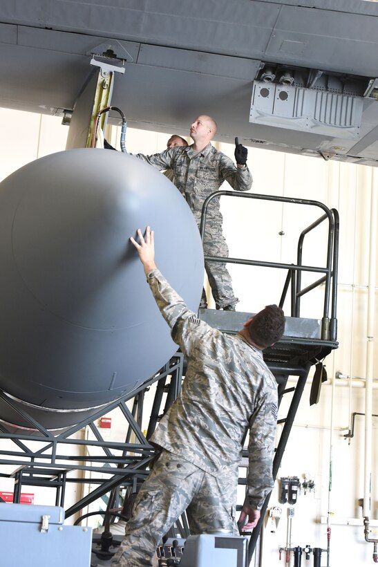 Pennsylvania Air National Guardsmen reattach an antenna pod to an EC-130J Commando Solo aircraft in a hangar in Middletown, Pa., April 5, 2017. Air National Guard photo by Master Sgt. Culeen Shaffer