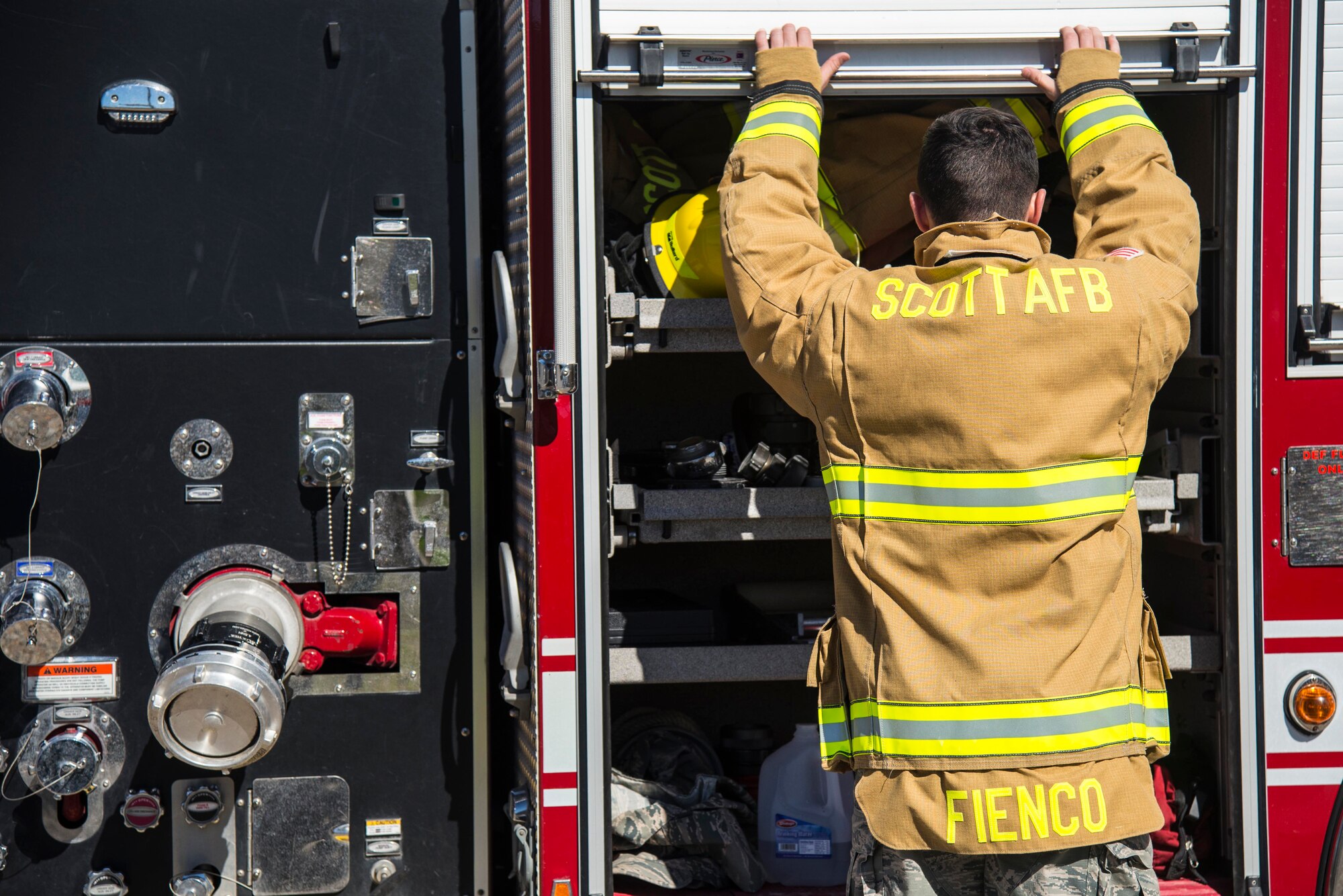 Firefighters with the 375th Civil Engineer Squadron performed drills in new structural gear at Scott. The new gear has a constructed outer shell capable of withstanding 1,100-1,200 degrees before degrading to the point of losing complete physical integrity. The thermal liner consist of two primary components that allow better moisture absorbency and allows sweat to be removed. Helmets are made smaller to offset risks associated with confined spaces or while wearing the self-contained breathing apparatus, and footwear has a steel toe with safety toe protection.
