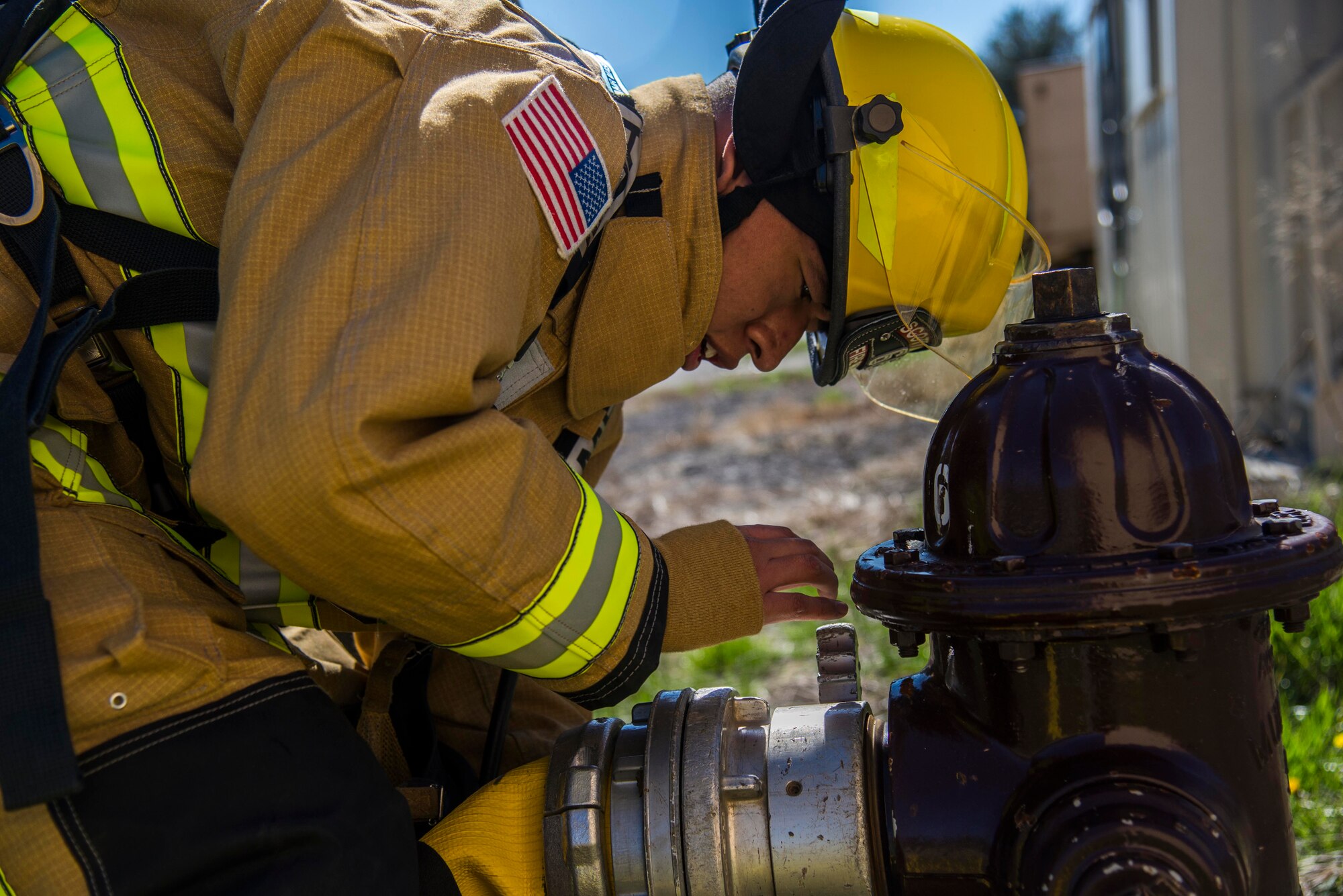 Firefighters with the 375th Civil Engineer Squadron performed drills in new structural gear at Scott. The new gear has a constructed outer shell capable of withstanding 1,100-1,200 degrees before degrading to the point of losing complete physical integrity. The thermal liner consist of two primary components that allow better moisture absorbency and allows sweat to be removed. Helmets are made smaller to offset risks associated with confined spaces or while wearing the self-contained breathing apparatus, and footwear has a steel toe with safety toe protection.