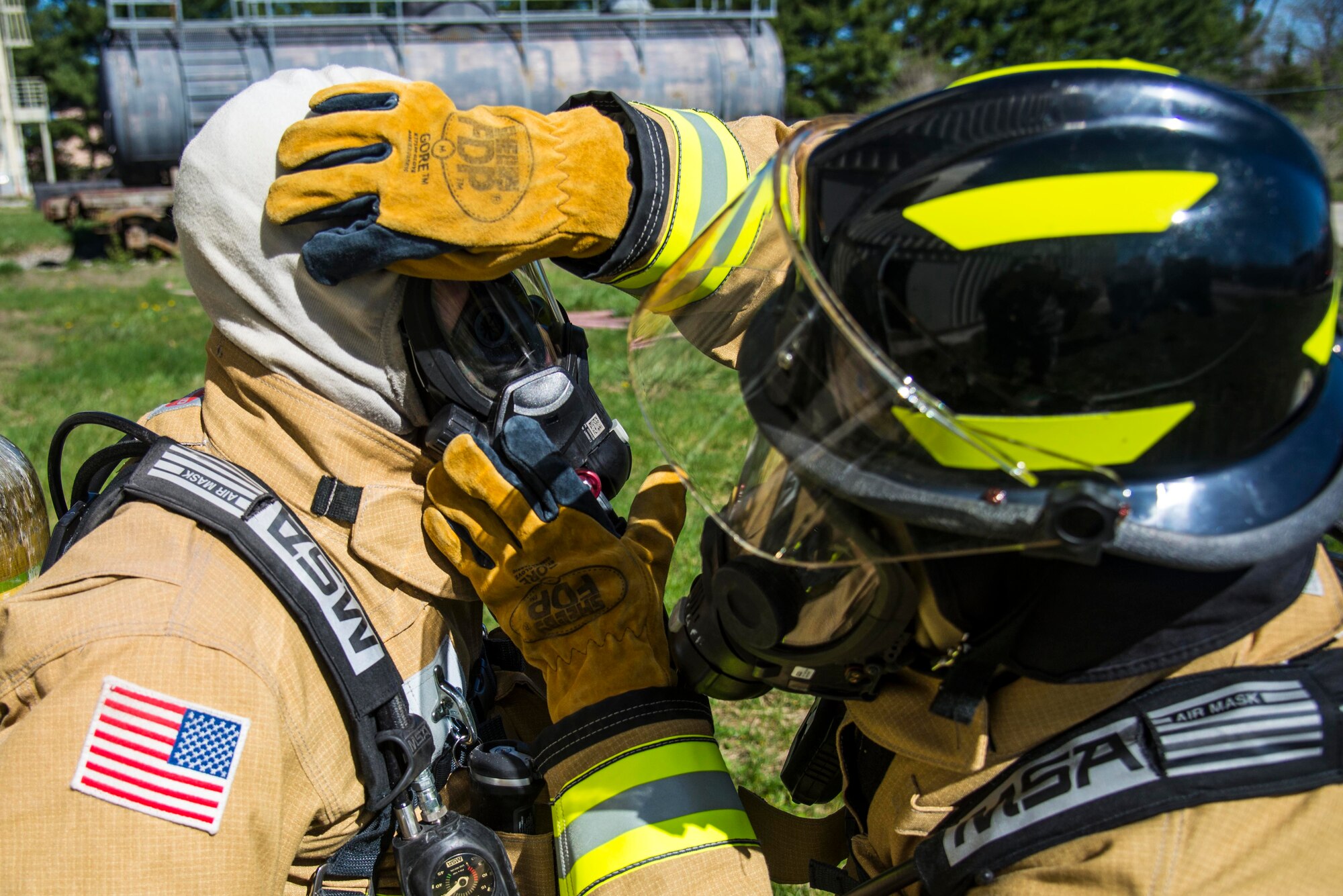 Firefighters with the 375th Civil Engineer Squadron performed drills in new structural gear at Scott. The new gear has a constructed outer shell capable of withstanding 1,100-1,200 degrees before degrading to the point of losing complete physical integrity. The thermal liner consist of two primary components that allow better moisture absorbency and allows sweat to be removed. Helmets are made smaller to offset risks associated with confined spaces or while wearing the self-contained breathing apparatus, and footwear has a steel toe with safety toe protection.