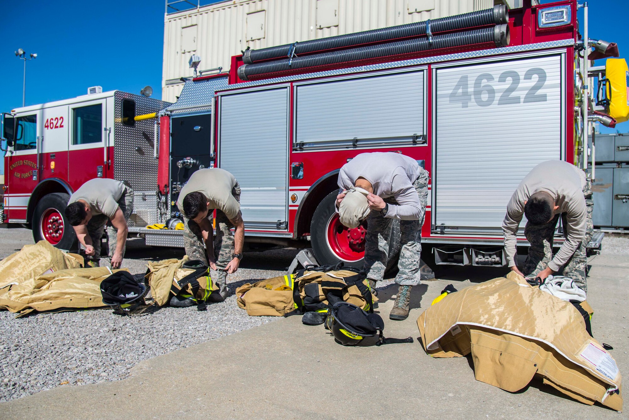 Firefighters with the 375th Civil Engineer Squadron performed drills in new structural gear at Scott. The new gear has a constructed outer shell capable of withstanding 1,100-1,200 degrees before degrading to the point of losing complete physical integrity. The thermal liner consist of two primary components that allow better moisture absorbency and allows sweat to be removed. Helmets are made smaller to offset risks associated with confined spaces or while wearing the self-contained breathing apparatus, and footwear has a steel toe with safety toe protection.