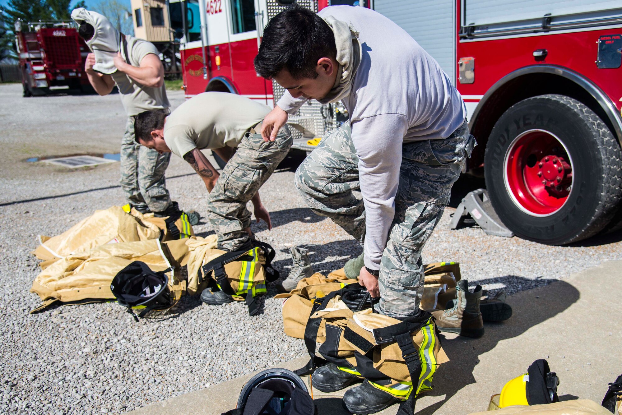 Firefighters with the 375th Civil Engineer Squadron performed drills in new structural gear at Scott. The new gear has a constructed outer shell capable of withstanding 1,100-1,200 degrees before degrading to the point of losing complete physical integrity. The thermal liner consist of two primary components that allow better moisture absorbency and allows sweat to be removed. Helmets are made smaller to offset risks associated with confined spaces or while wearing the self-contained breathing apparatus, and footwear has a steel toe with safety toe protection.