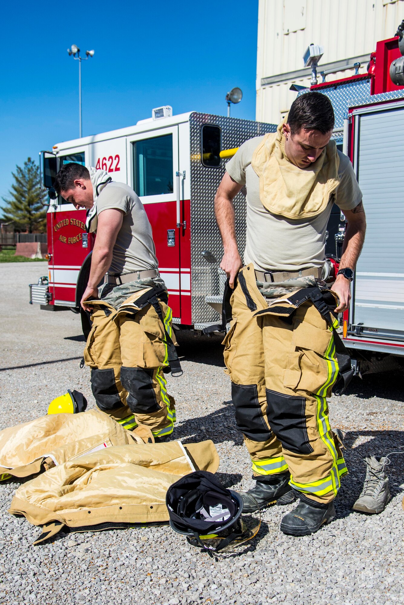 Firefighters with the 375th Civil Engineer Squadron performed drills in new structural gear at Scott. The new gear has a constructed outer shell capable of withstanding 1,100-1,200 degrees before degrading to the point of losing complete physical integrity. The thermal liner consist of two primary components that allow better moisture absorbency and allows sweat to be removed. Helmets are made smaller to offset risks associated with confined spaces or while wearing the self-contained breathing apparatus, and footwear has a steel toe with safety toe protection.