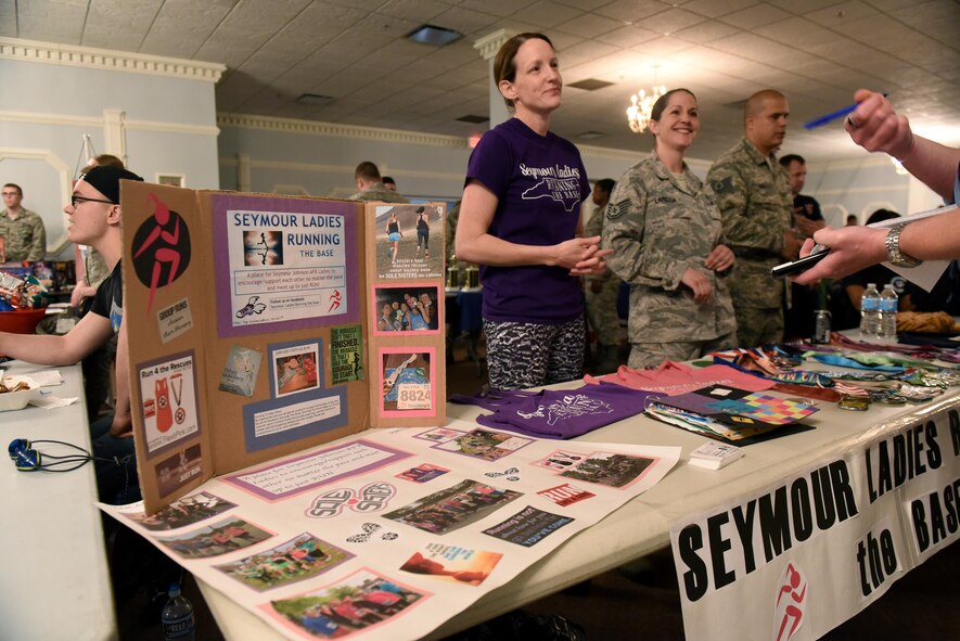 Senior Master Sgt. Kiera Daniels, 4th Medical Group first sergeant, and Tech. Sgt. Christina Lariccia, 4th Medical Support Squadron pharmacy technician, represent the Seymour Ladies Running club at MIBCON17, March 31, 2017, at Seymour Johnson Air Force Base, North Carolina. MIBCON17 showcased the base’s Make It Better initiative to create interactive events for Airmen and their families to participate in and increase morale. (U.S. Air Force photo by Airman 1st Class Kenneth Boyton)