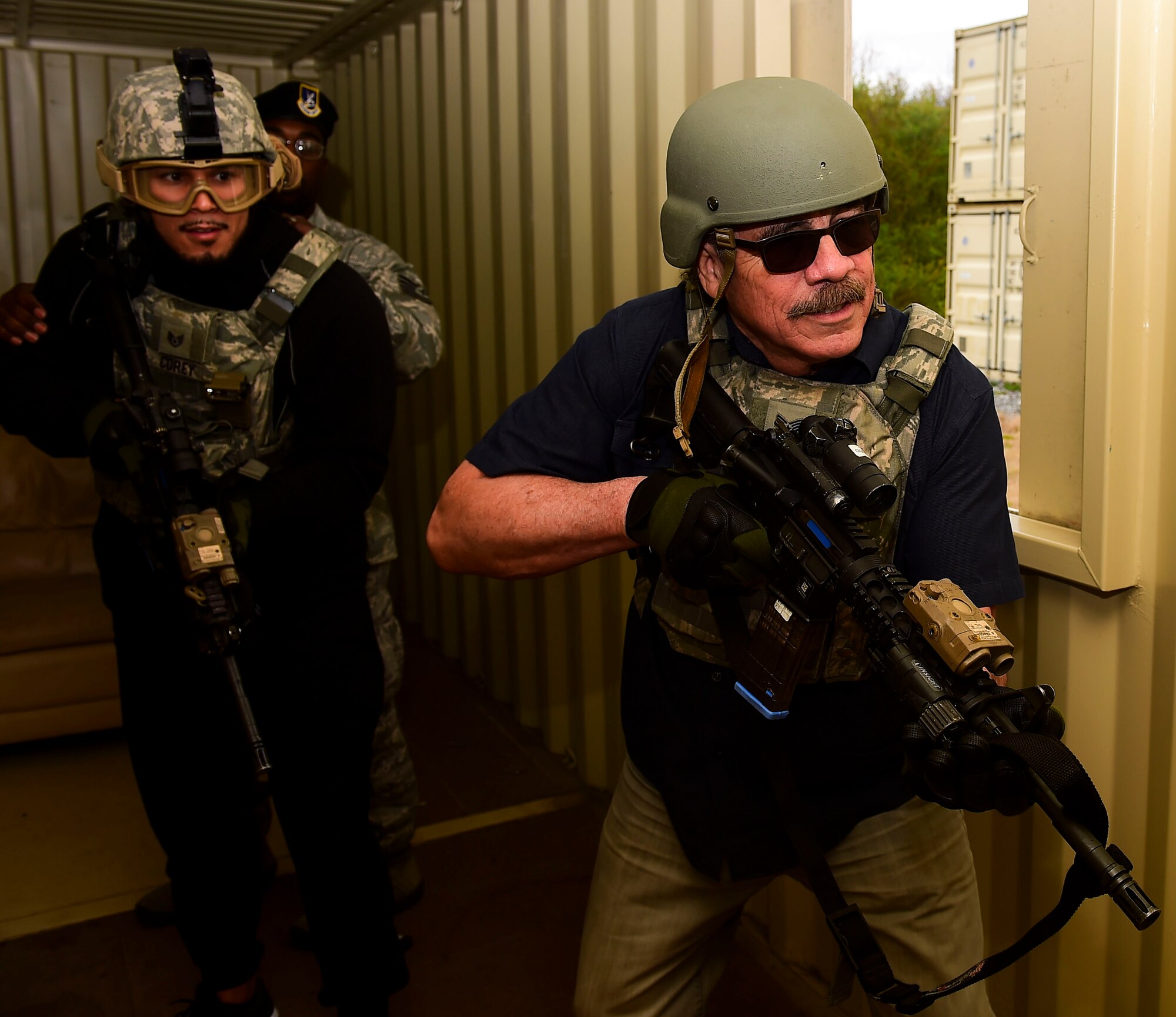 Jacob “Stitch” Duran, professional cutman, and Brad Tavares, UFC Middleweight fighter, clear a building during their visit to Joint Base Langley-Eustis, Va., April 7, 2017. Duran was a prior Security Forces member during his enlistment in the U.S. Air Force. (U.S. Air Force photo/Senior Airman Derek Seifert)