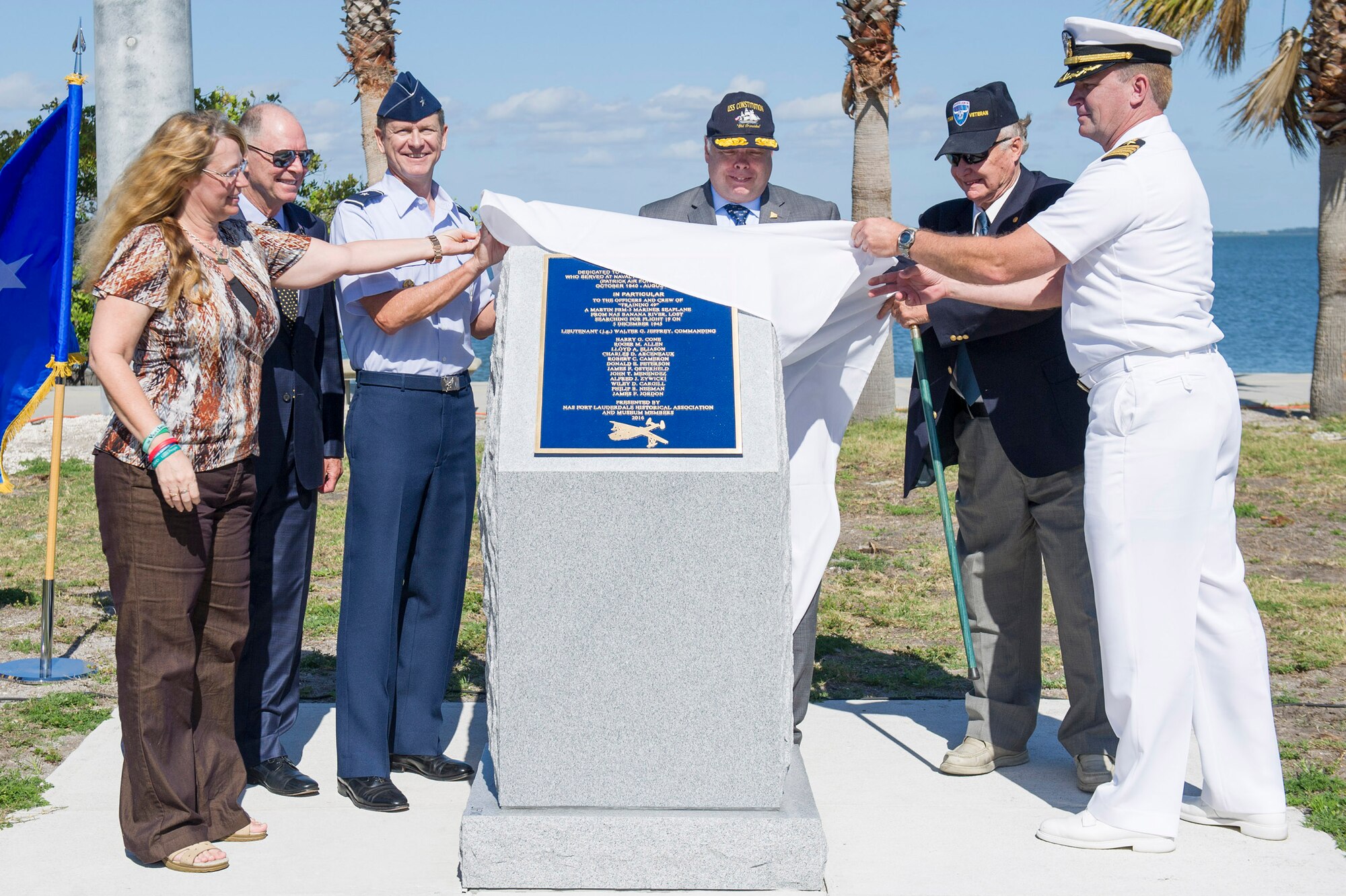 Debbie Wilson, daughter of Joh Myhre; Rep. Bill Posey, 8th District of Florida; Brig. Gen. Wayne Monteith, 45th Space Wing commander; Retired Navy Rear Admiral Samuel Cox, Naval history and heritage command director and curator; Retired Army Capt. Jon Myhre, Naval Air Station Fort Lauderdale historical association and museum member; and Capt. John Sager, Naval Ordnance Test Unit commander, unveil the Banana River Naval Air Station Monument during a ceremony April 11, 2017, at Patrick Air Force Base, Fla. The 45th Space Wing hosted a dedication ceremony for the Martin PBM-5 Mariner Memorial honoring 13 service members who lost their lives during a rescue mission supporting the 1945 disappearance of Flight 19.  (U.S. Air Force photo by Phil Sunkel) 
