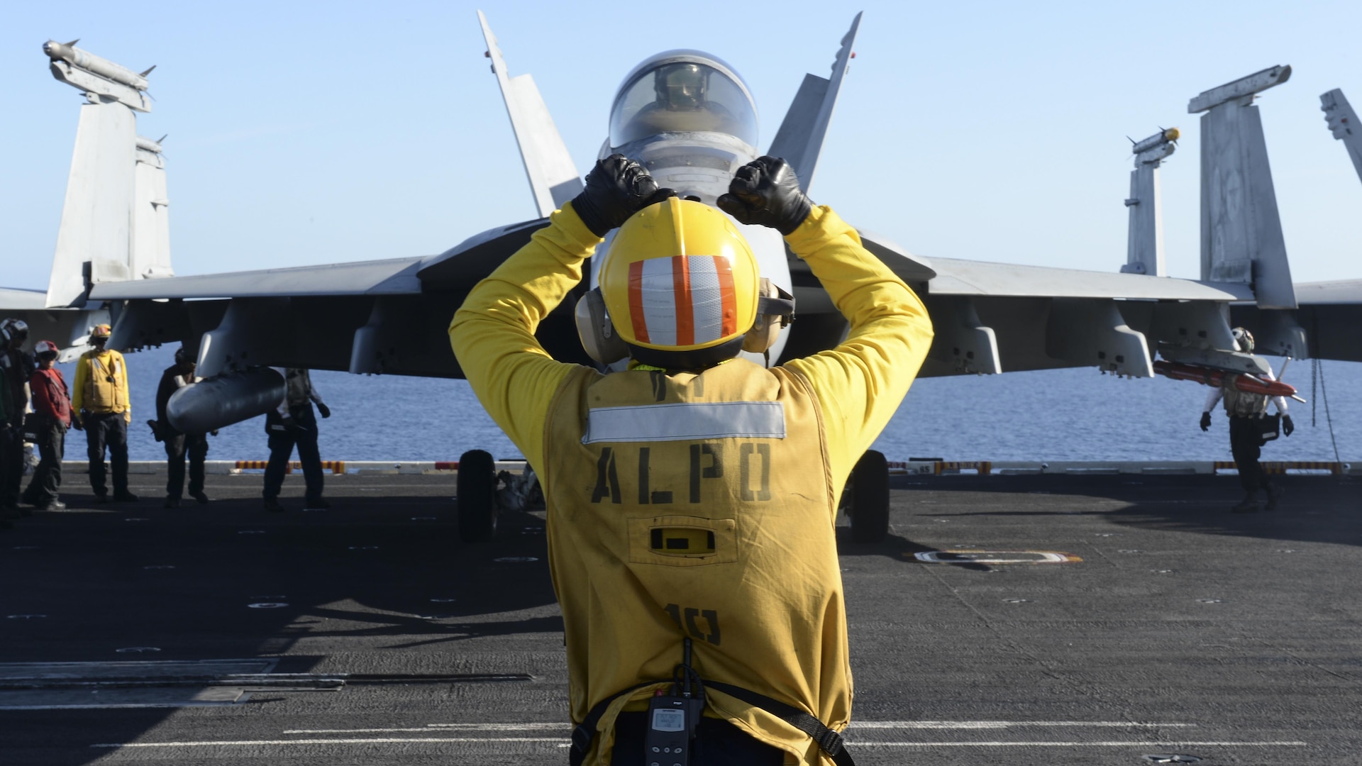 U.S. Navy Aviation Boatswain's Mate (Handling) 1st Class Ryan Hilliard, a native of Erie, Pa., directs an aircraft on the flight deck of the aircraft carrier USS Nimitz (CVN 68) April 7, 2017. Nimitz is currently underway in the Pacific Ocean conducting Composite Training Unit Exercise (COMPTUEX) with the Nimitz Carrier Strike Group in preparation for an upcoming deployment. COMPTUEX tests a carrier strike group's mission-readiness and ability to perform as an integrated unit through simulated real-world scenarios. 