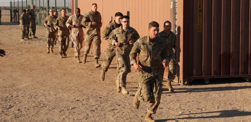 U.S. Servicemembers race to the start of the ‘Tough One’ obstacle during day zero of U.S. Army Central’s first Air Assault Course, April 4, 2017, at Camp Buehring, Kuwait. The ‘Tough One’ obstacle includes rope, net climbing and walking along wooden planks. It is one of two obstacles candidates must pass in order to continue forward on day zero. The Air Assault Course allows U.S. military personnel in the USARCENT theater of operations the unique opportunity to become air assault qualified, while deployed outside the continental United States.