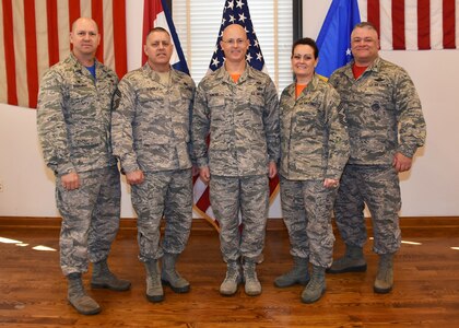 Master Sgt. Thomas DuMont, center, is the Air National Guard’s 2016 Outstanding Airman of the Year in the Senior Noncommissioned Officer category. He is pictured here with 131st Bomb Wing leadership during a recent ceremony.  (l to r:  157th Air Operations group commander, Col. William Boothman, 131BW Chief Master Sgt. Michael Perry, Master Sgt. Thomas DuMont, 131BW Command Chief Master Sgt. Jessica Settle,  131BW commander Col. Kenneth Eaves. 