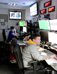 Michael Nelson, The Greater Richmond ARC contracted emergency dispatcher, manages multiple support programs and monitors in the Emergency Communications Center at Defense Supply Center Richmond, Virginia, during a tornado drill March 21, 2017.