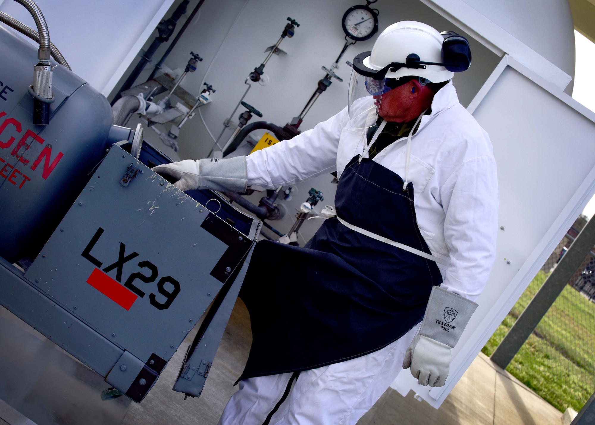 James Baldwin, 733rd Logistics Readiness Squadron fuels facilities fuels distribution systems operator, fills a liquid oxygen cart at Joint Base Langley-Eustis, Va., April 7, 2017. According to U.S. Air Force standards liquid oxygen has to be at least 99.5 percent pure. (U.S. Air Force photo/Staff Sgt. Areca T. Bell)