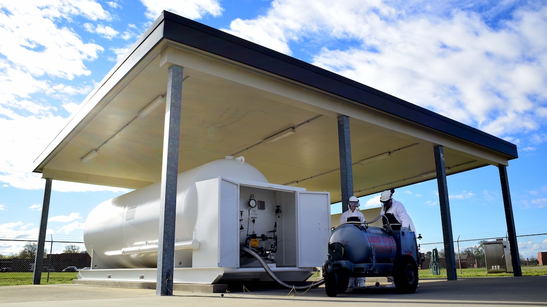 U.S. Air Force Airman 1st Class Austin Wesson, 733rd Logistics Readiness Squadron fuels distribution operator, and James Baldwin, 733rd LRS fuels facilities fuels distribution systems operator, fill a liquid oxygen cart at Joint Base Langley-Eustis, Va., April 7, 2017. Every 90 days a sample of liquid oxygen has to be taken and sent to lab for inspection at Wright Patterson Air Force Base, Ohio, to ensure it is at least 99.5 percent pure. (U.S. Air Force photo/Staff Sgt. Areca T. Bell)