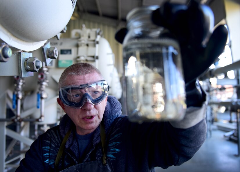 Darryl Hodge, 733rd Logistics Readiness Squadron fuels facilities fuels distribution systems operator, takes a fuel sample at Joint Base Langley-Eustis, Va., April 10, 2017. In addition to its impact on flightline operations, fuels facilities also ensure government vehicles on base are provided with fuel and buildings are supplied with ground products they many need, including gasoline, standard low sulfur diesel and biodiesel, which is more environmentally friendly. (U.S. Air Force photo/Staff Sgt. Areca T. Bell)