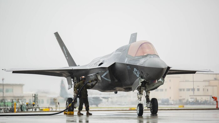 U.S. Marine Corps Lance Cpl. Keon Willingham, a powerline mechanic with Marine Fighter Attack Squadron (VMFA) 121, detaches a hose from the squadron’s F-35B Lightning II aircraft during aviation delivered ground refueling training with Marine Aerial Refueler Transport Squadron (VMGR) 152 at Marine Corps Air Station Iwakuni, Japan, April 11, 2017. The ADGR marked the first evolution of this form of refueling for VMFA-121’s F-35B Lightning II aircraft, and it increases the squadron’s ability to refuel by C-130 aircraft in austere locations when other resources may not be available.  