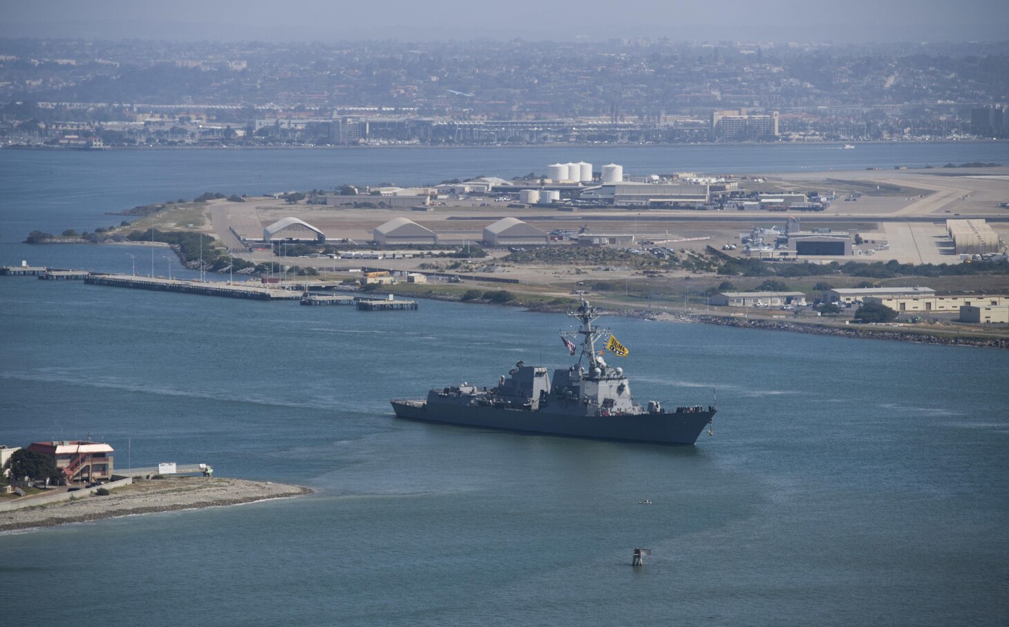 Arleigh Burke-class guided-missile destroyer USS Dewey (DDG 105) exits the harbor as part of the Sterett-Dewey Surface Action Group (SAG). The Sterett-Dewey SAG is the third deploying group operating under the command and control construct called 3rd Fleet Forward, March 31. 2017. The first iteration in recent history occurred in 2016 with the Pacific Surface Action Group (PACSAG) deployment and was further executed with the January 2017 deployment of the Carl Vinson Strike Group. 