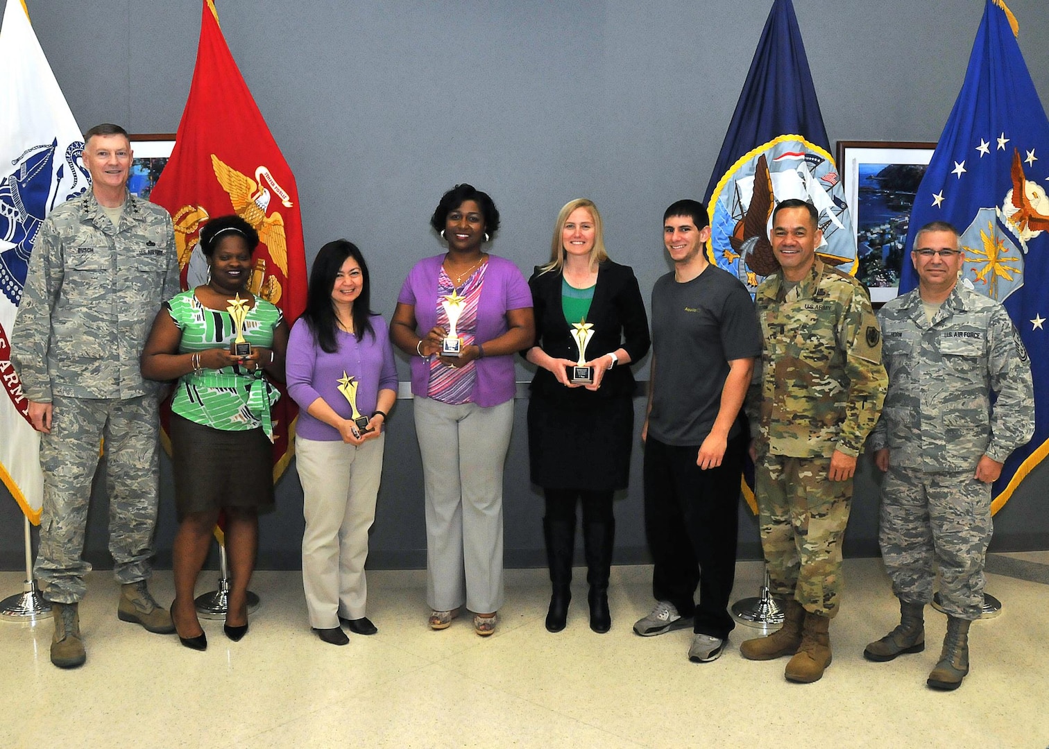 Senior leaders pose with "Ladies DSW 2.0," the first-place team, at the 2017 Winter Warrior Project awards ceremony, April 12, 2017, Fort Belvoir, Virginia. From left: DLA Director Air Force Lt. Gen. Andy Busch; Anita Elum-Mason; Rowena Estrada; Ahawana Williams; Christina Darensbourg; team coach Demetrios Danis; Army Command Sgt. Major Charles Tobin, DLA senior enlisted leader; Air Force Chief Master Sgt. Timothy Horn, DTRA senior enlisted leader.