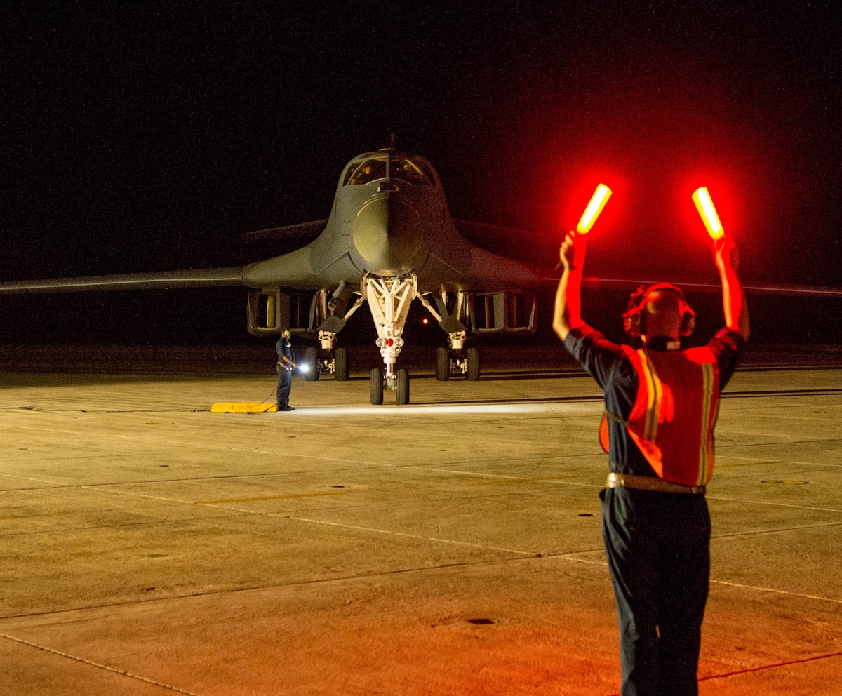 Tech. Sgt. Brian Svedin, 489th Maintenance Squadron crew chief, marshals a returning B-1 Lancer at the Boca Chica Naval Air Station, Key West Fla., flightline after its role in the Joint Interagency Task Force South mission March 23, 2017. Airmen from the 489th Bombardment Group and the 7th Bomb Wing supported the Drug Enforcement Agency, FBI, Coast Guard and other government agencies in the fight against illicit drugs. (U.S. Air Force photo by Staff Sgt. Jason McCasland/released)