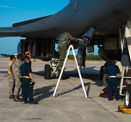 Col. Justin Boldenow, 7th Operations Group commander, inspects a targeting pod on a B-1 Lancer at the Boca Chica Naval Air Station, Key West Fla., March 24, 2017.  This targeting pod is capable of tracking, targeting and engaging moving targets. The Joint Interagency Task Force South used the B-1 to track drug smugglers “go-fast” boats across more than 3.2 million square miles of ocean.(U.S. Air Force photo by Staff Sgt. Jason McCasland/released)