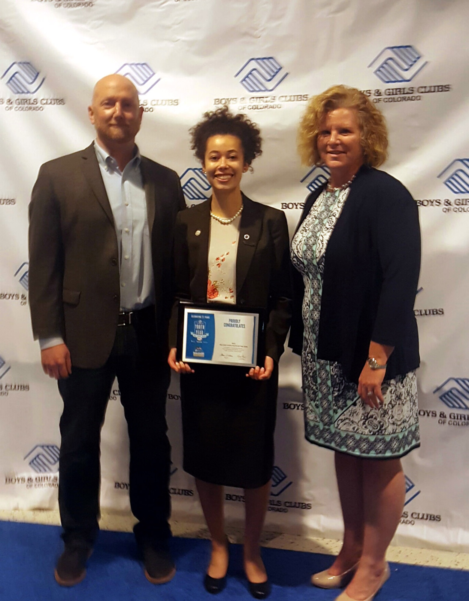 Danielle Wright, Colorado Military Youth of the Year, poses between Vincent Kurtz, 460th Force Support Squadron team coordinator, and Kaureen Whittaker, 460th FSS youth programs chief, March 28, 2017, at the National Youth of the Year Celebration in Denver. Youth of the Year is a national Boys & Girls Club program, and was established to recognize and honor the nation’s most inspirational teens. (Courtesy photo)