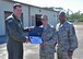 Col. Michael Hernandez, 325th Fighter Wing commander, and Chief Master Sgt. Craig Williams, 325th FW command chief, congratulate Tech. Sgt. Evan Oehlbeck, 325th Maintenance Squadron munitions control supervisor, on being promoted by the Stripes for Exceptional Performers program April 11, 2017 at Tyndall Air Force Base, Fla. The STEP program supplements the existing airmen promotion program and is designed to accommodate unique circumstances that, in the commander’s judgment, clearly warrant promotion. (U.S. Air Force photo by Senior Airman Sergio A. Gamboa/Released)