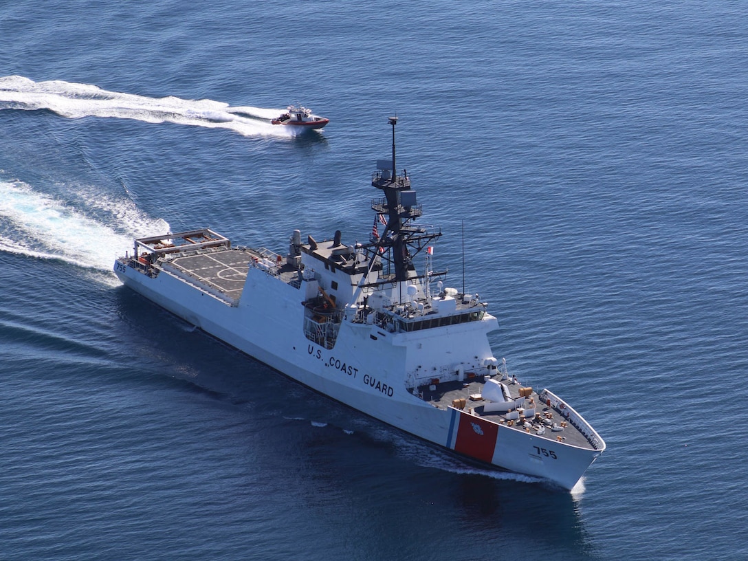 Crewmembers aboard the Coast Guard Cutter Munro, a 418-foot National Security Cutter, and its small boat transit the Gulf of Mexico on Feb. 12, 2017. National Security Cutters are sophisticated platforms and allow crews to protect our borders, supporting national security and prosperity. U.S. Coast Guard photo by Seaman Courtney Fussell.
