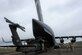 A UH-60 Black Hawk helicopter is loaded into a C-17 Globemaster III April 7 at Yakima Training Center, Washington. Members of the 21st Airlift Squadron at Travis Air Force Base, Calif., flew to Yakima and completed a joint training mission with an Army Medevac unit to practice loading UH-60 Black Hawk helicopters. (U.S. Air Force photo / 2nd. Lt. Sarah Johnson)