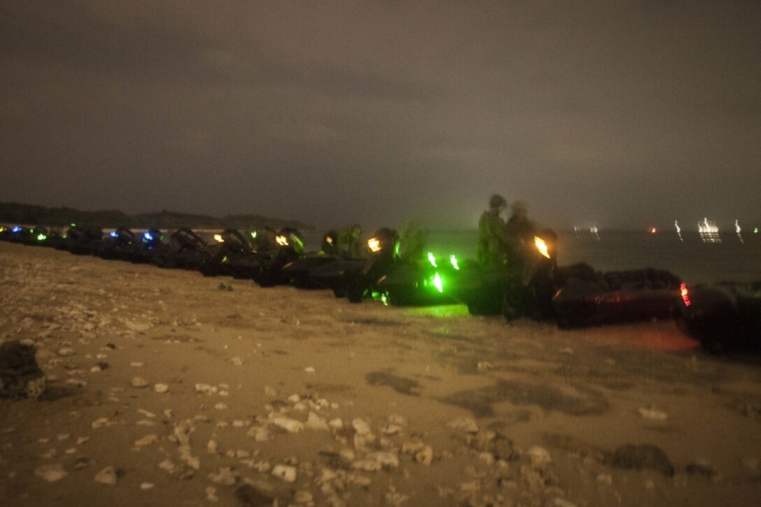 Marines with Fox Company, Battalion Landing Team 2nd Battalion, 5th Marine Regiment, 31st Marine Expeditionary Unit, provide security for incoming Combat Rubber Raiding Crafts during a boat raid at Kin Blue Training Area, Okinawa, Japan, Mar. 22, 2017. Fox Co., BLT 2/5 conducted the boat raid during Certification Exercise as a part of the 31st MEU's 17.1 Spring Patrol. As the Marine Corps' only continuously forward-deployed unit, the 31st Marine Expeditionary Unit's air-ground-logistics team provides a flexible force, ready to perform a wide range of military operations, from limited combat to humanitarian assistance operations, throughout the Indo-Asia-Pacific region. (U.S. Marine Corps photo by Lance Cpl. Jorge A. Rosales/ Released) 