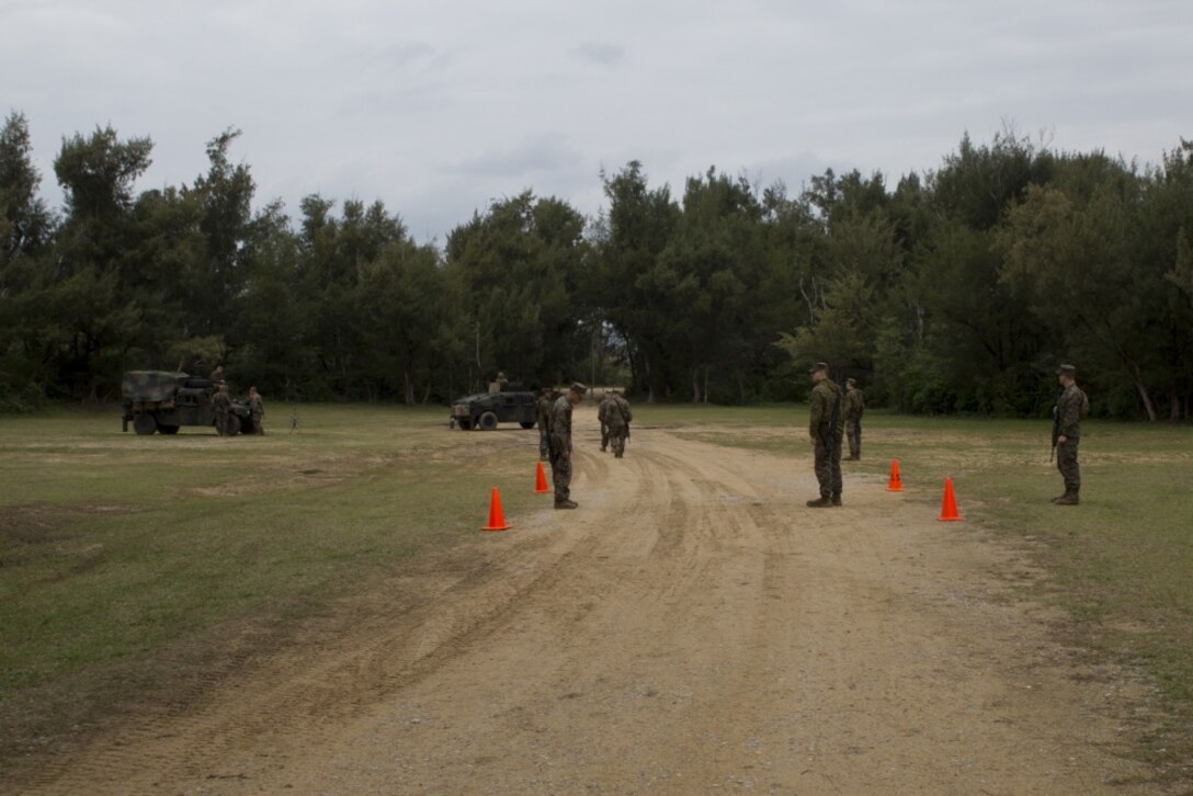Marines with Combat Logistics Battalion 31, 31st Marine Expeditionary Unit, post security at a supply point a Kin Blue Training Area, Okinawa, Japan, March 26, 2017. The Marines conducted Humanitarian Aid and Disaster Relief training during Certification Exercise for the MEU’s 17.1 Spring Patrol. As the Marine Corps’ only continuously forward deployed unit, the 31st MEU’s air-ground-logistics team provides a flexible force, ready to perform a wide range of military operations, from limited combat to humanitarian assistance operations, throughout the Indo-Asia-Pacific region. (U.S. Marine Corps photo by Lance Cpl. Breanna L. Weisenberger/Released) 