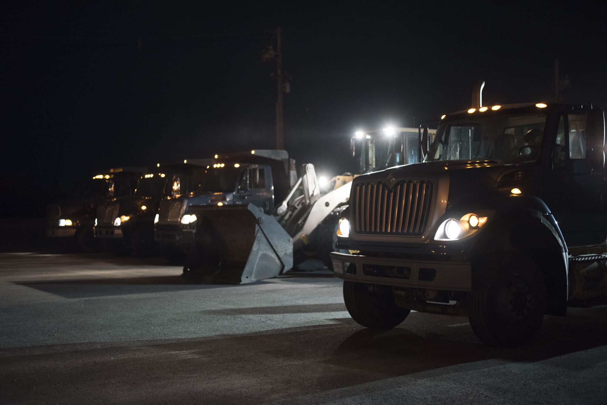 U.S. Air Force 18th Civil Engineer Squadron Airmen operate heavy machinery to perform airfield damage repair operations during a no-notice training exercise, April 12, 2017, at Kadena Air Base, Japan. The 18th Wing’s aircraft generation and combat mission are directly affected by the status of the runway. By quickly performing airfield damage repair operations, the 18th CES is able to ensure the 18th Wing is able to constantly generate aircraft despite sustaining damage to airfields. (U.S. Air Force photo by Senior Airman Omari Bernard)