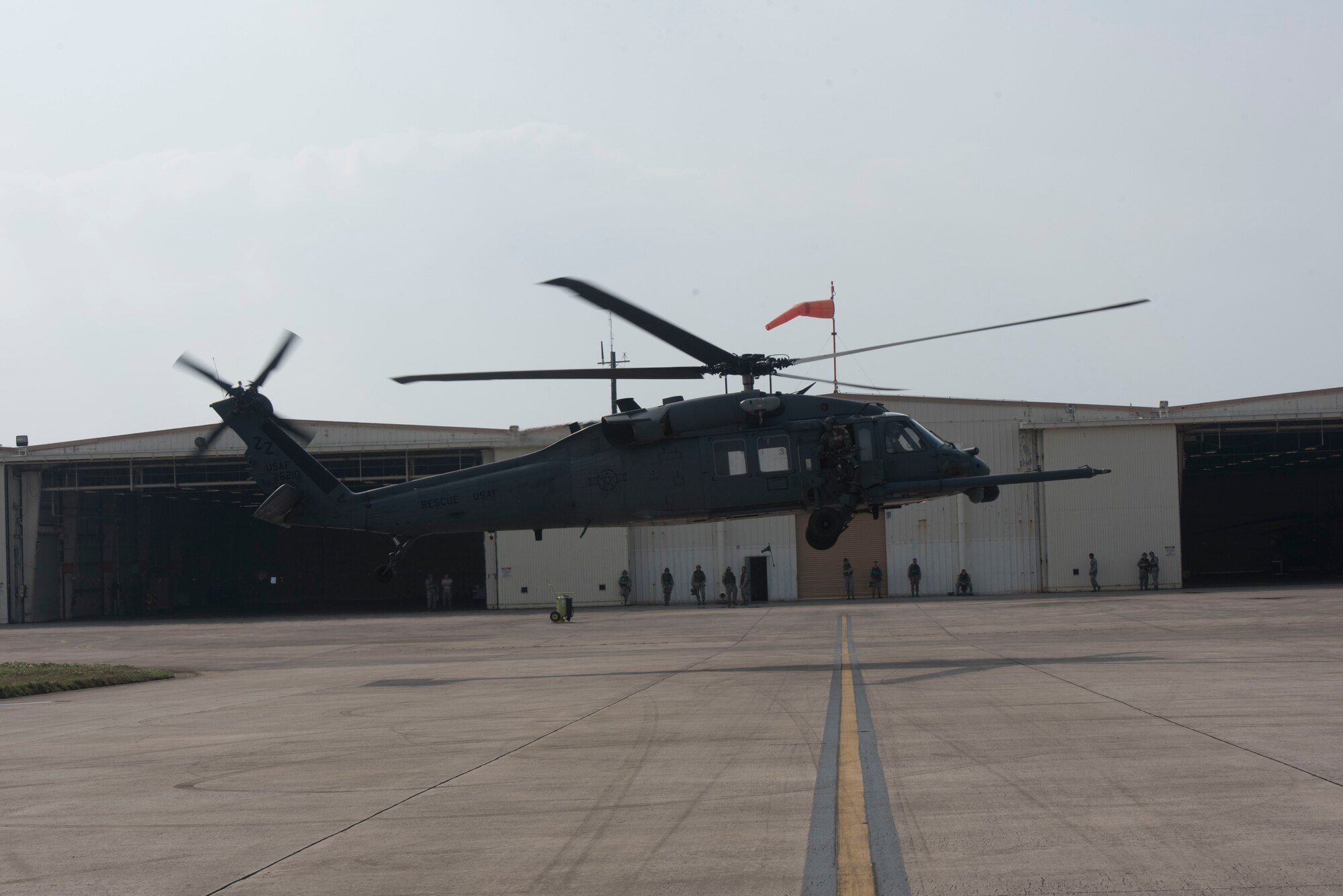 A U.S. Air Force 33rd Rescue Squadron HH-60 Pave Hawk takes off for a sortie during a no-notice training exercise April 12, 2017, at Kadena Air Base, Japan. Team Kadena conducts exercises to maintain a well-trained force which provides around the clock operational support to enhance peace and security in the Pacific and the mutual defense of Japan. (U.S. Air Force photo by Senior Airman John Linzmeier)