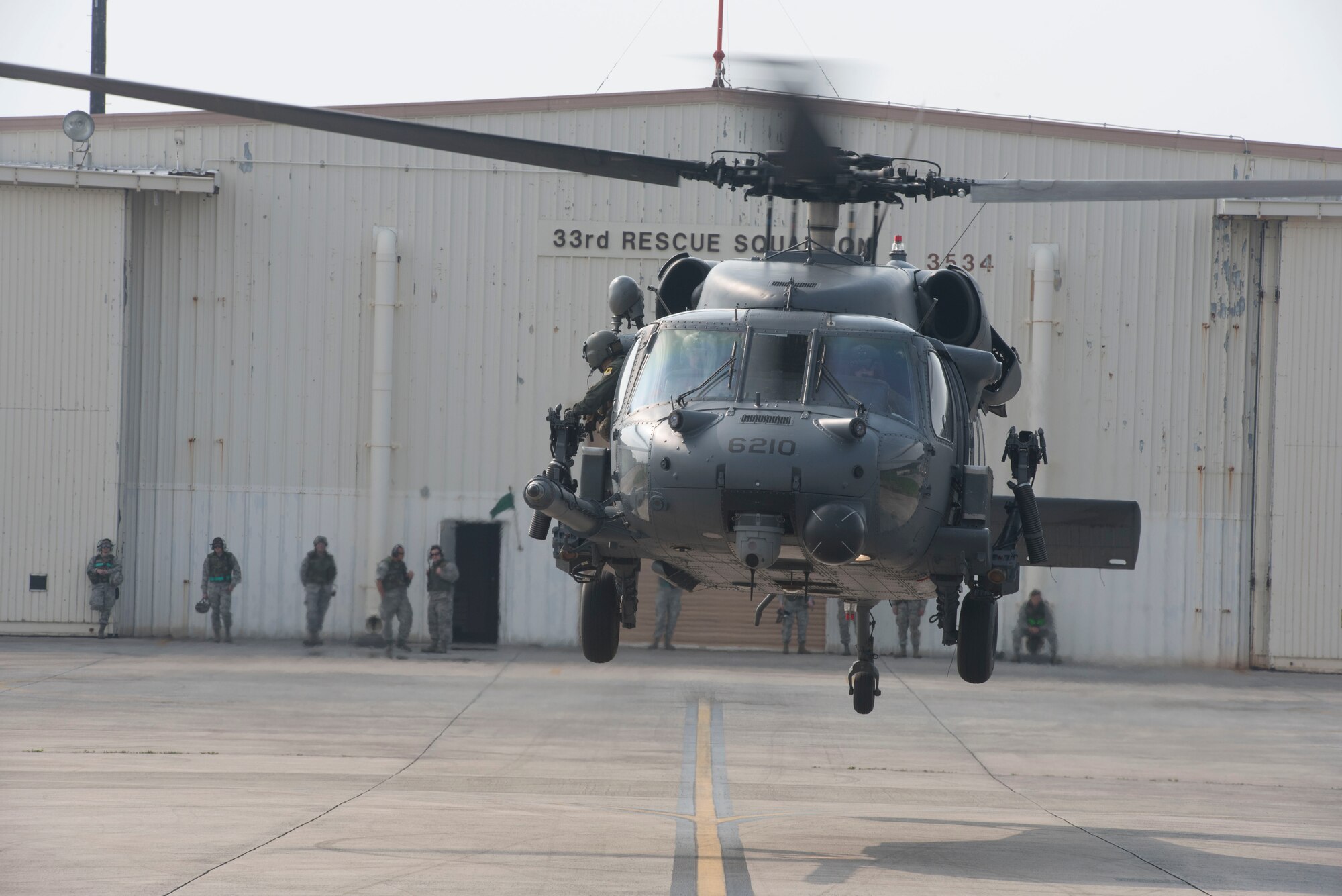 A 33rd Rescue Squadron HH-60 Pave Hawk takes off to conduct training operations during a no-notice exercise April 12, 2017, at Kadena Air Base, Japan. The 18th Wing is capable of rapidly generating combat ready aircraft and support at a moment’s notice, and exercises keep members of Team Kadena ready around the clock to defend Okinawa from threats. (U.S. Air Force photo by Senior Airman John Linzmeier)