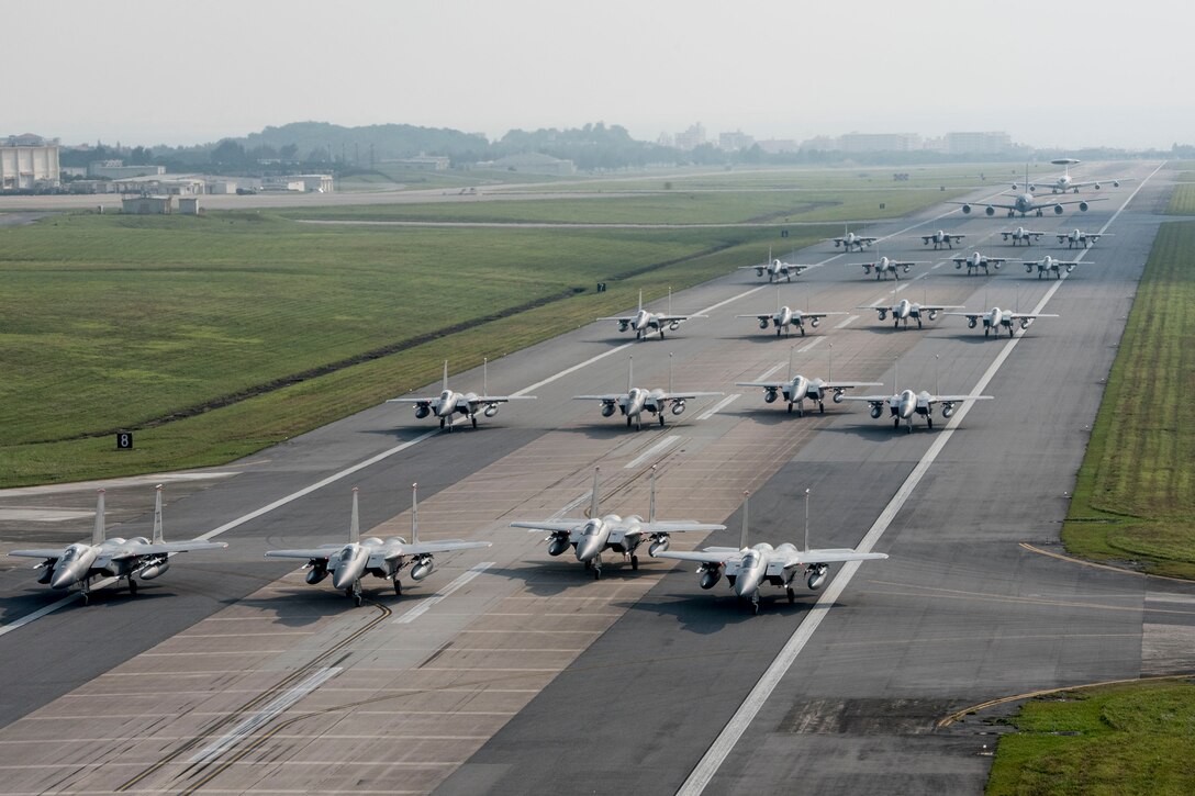 U.S. Air Force 44th and 67th Fighter Squadron F-15 Eagles and 961st Airborne Air Control Squadron E-3 Sentries taxi down the runway during a no-notice exercise April 12, 2017, at Kadena Air Base, Japan. The elephant walk showcased Team Kadena's ability to quickly generate combat air power in the event of an attack on Okinawa. Operating from the largest U.S. military installation in the Indo-Asia-Pacific region, the 18th Wing defends U.S. and Japanese mutual interests by providing a forward power projection platform with fully integrated, deployable combat power. (U.S. Air Force photo by Senior Airman John Linzmeier)