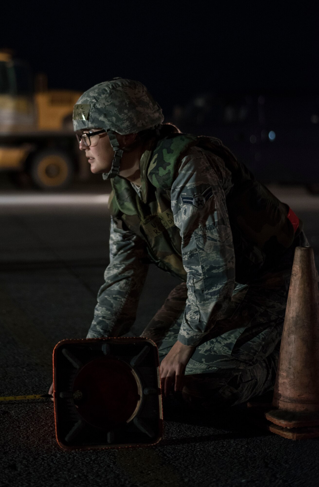 U.S. Air Force Airman 1st Class Diane Rosch, 718th Civil Engineer Squadron engineer apprentice, measures the length of a mock flightline during the air field damage repair scenario of a no-notice training exercise April 12, 2017, at Kadena Air Base, Japan. Airmen at every level are empowered to lead decisively and play key roles in operations, especially during times of crisis. (U.S. Air Force photo by Senior Airman Omari Bernard)