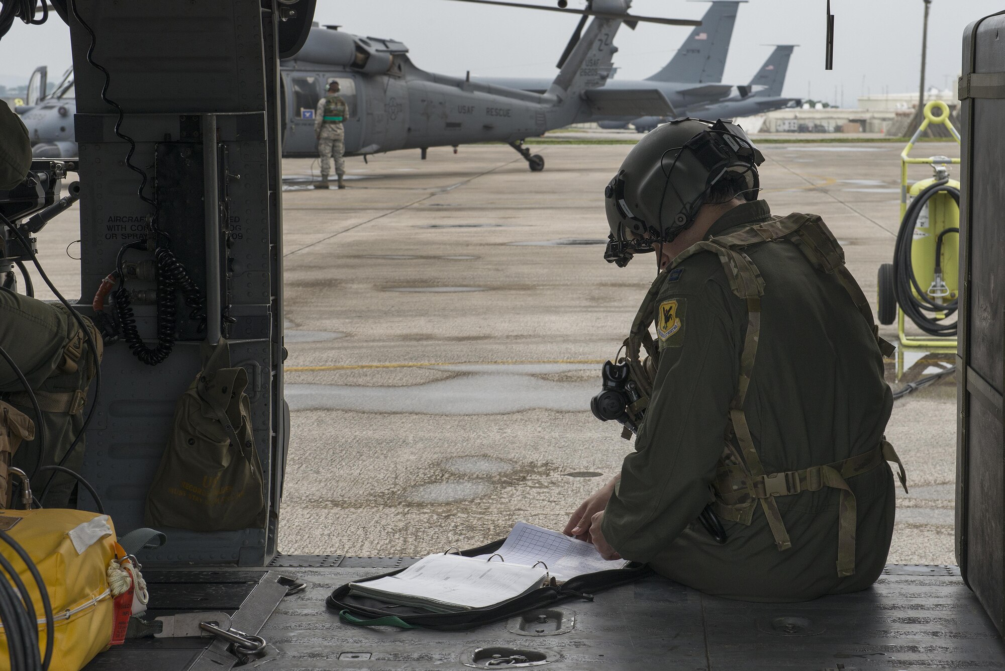 A U.S. Air Force Airman with the 33rd Rescue Squadron inspects a log during a training exercise April 12, 2017, at Kadena Air Base, Japan. Exercises keep members of Team Kadena ready for any situation in the defense of Japan and U.S. interests throughout the Indo-Asia Pacific Theater. (U.S. Air Force photo by Senior Airman John Linzmeier)
