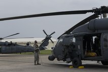 A U.S. Air Force Airman runs through pre-flight procedures of a 33rd Rescue Squadron HH-60 Pave Hawk during a training exercise April 12, 2017, at Kadena Air Base, Japan. Maintaining operational readiness is essential for the 18th Wing to be able to respond to any natural disaster or adversarial threat in the region. (U.S. Air Force photo by Senior Airman John Linzmeier)