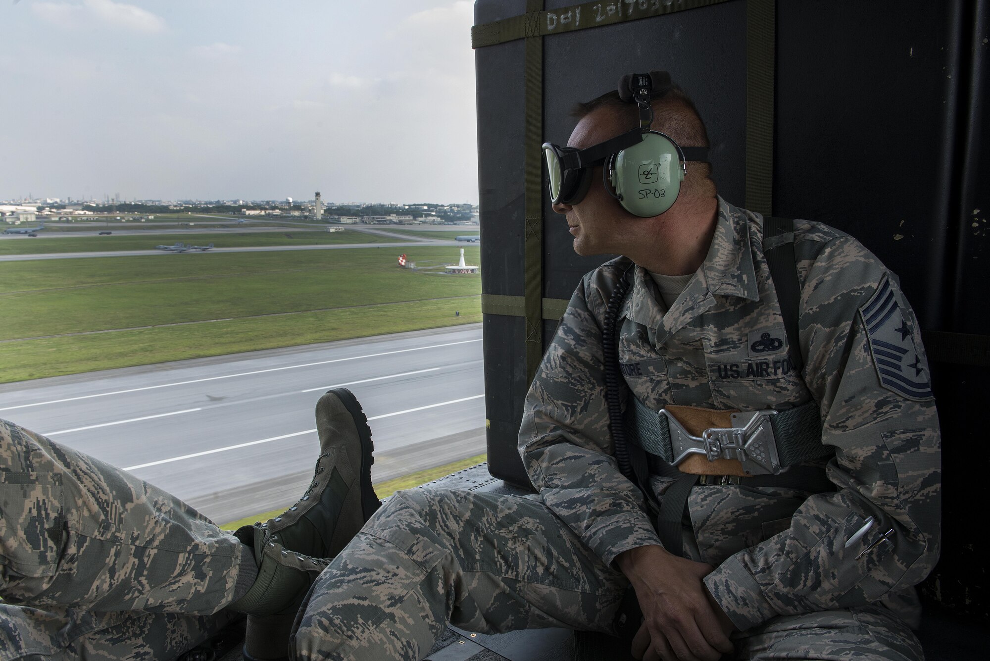 U.S. Air Force Chief Master Sgt. Michael Ditore, 18th Wing command chief, observes the flightline during a training exercise April 12, 2017, at Kadena Air Base, Japan. Ditore observed the execution of a flightline elephant walk displaying the aircraft of the 18th Wing. Because of the changing nature of warfare, Airmen of the 18th Wing can fight from anywhere, at any time, and exercises like this ensure they are ready to execute the mission.  (U.S. Air Force photo by Senior Airman John Linzmeier)