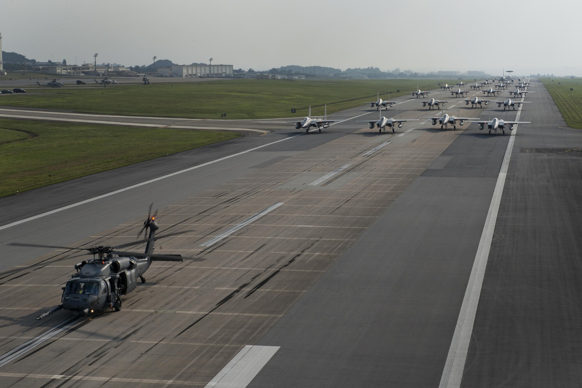 Aircraft from the 18th Wing perform an elephant walk during a no-notice readiness exercise April 12, 2017, at Kadena Air Base, Japan. Aircraft from the 33rd Rescue Squadron, 44th and 67th Fighter Squadrons, 909th Air Refueling Squadron,and the 961st Airborne Air Control Squadron generated simultaneously for the elephant walk to demonstrate Kadena's ability to sortie all combat aircraft assets in a short amount of time. (U.S. Air Force photo by Senior Airman John Linzmeier)