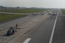 Aircraft from the 18th Wing perform an elephant walk during a no-notice readiness exercise April 12, 2017, at Kadena Air Base, Japan. Aircraft from the 33rd Rescue Squadron, 44th and 67th Fighter Squadrons, 909th Air Refueling Squadron,and the 961st Airborne Air Control Squadron generated simultaneously for the elephant walk to demonstrate Kadena's ability to sortie all combat aircraft assets in a short amount of time. (U.S. Air Force photo by Senior Airman John Linzmeier)