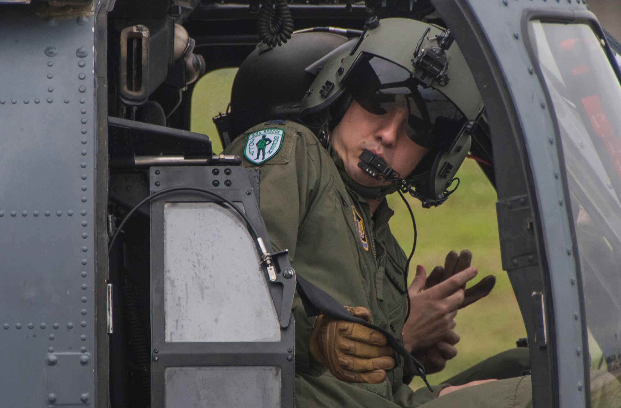 A pilot with the 33rd Rescue Squadron buckles into an HH-60 Pave Hawk during a training sortie April 11, 2017, at Kadena Air Base, Japan. The 18th Wing maintains constant mission readiness, to enhance peace and security in the Pacific and defense of U.S. and allied and interests throughout the Indo-Asia Pacific Theater. (U.S. Air Force photo by Senior Airman John Linzmeier)
