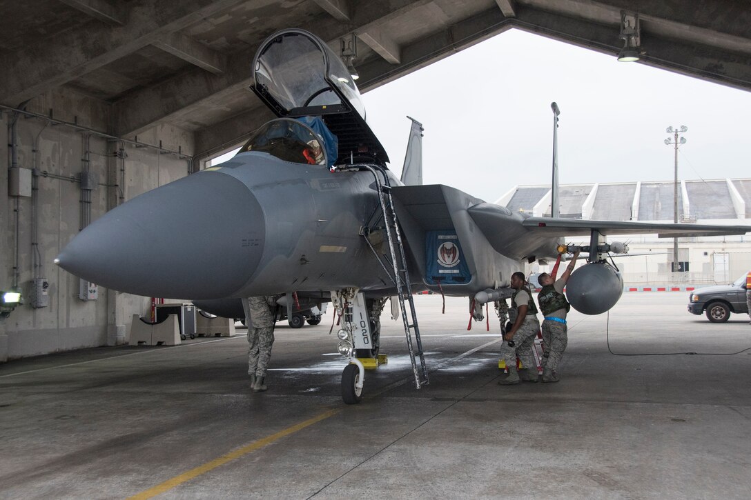 U.S. Air Force 44th Aircraft Maintenance Unit weapons load crew members conduct a weapons-post-load inspection on a 44th Fighter Squadron F-15 Eagle April 12, 2017, at Kadena Air Base, Japan. Operating as the largest U.S. installation in the Asia-Pacific region, the 18th Wing at Kadena AB provides fully integrated forward power projection with readily deployable combat power, enabling theater commanders to adapt response forces to any adversary at any time. (U.S. Air Force photo by Senior Airman John Linzmeier)