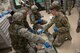 U.S. Air Force Airmen and Army Soldiers perform life-saving techniques on a simulated casualty as part of an exercise April 12, 2017, at Kadena Air Base, Japan. In times of crisis, Airmen of the 18th Wing are trained to act swiftly and appropriately while integrating joint and allied forces to adapt to any situation. (U.S. Air Force photo by Senior Airman John Linzmeier)