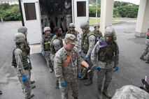 U.S. Air Force Airmen carry a litter during a training exercise April 12, 2017, at Kadena Air Base, Japan. The fully integrated joint and allied combat capability of the 18th Wing at Kadena AB provides around the clock operational support that can adapt to any situation for the mutual defense of Japan and promoting peace and security throughout the Pacific region. (U.S. Air Force photo by Senior Airman John Linzmeier)