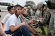 U.S. Air Force Airmen provide aid to victims of a simulated attack during a training exercise April 12, 2017, at Kadena Air Base, Japan. Mission-focused exercises enable units to hone skills for real-world applications in a variety of scenarios.  Sharpening those skills helps to ensure Airmen are ready to respond to any crisis at a moment's notice. (U.S. Air Force photo by Senior Airman John Linzmeier)