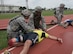 U.S. Air Force Airmen provide aid to simulated victims of an attack April 12, 2017, at Kadena Air Base, Japan. The 18th Wing and its associate units are responsible for providing forward power projection with integrated, deployable combat power. (U.S. Air Force photo by Senior Airman John Linzmeier)