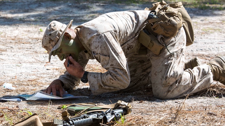 Lance Cpl. Kevin P. Chapman plots points on his map during a scout sniper screener at Marine Corps Base Camp Lejeune, N.C., April 3, 2017. The Marines were evaluated on activities such as foot patrols and land navigation while working on little food and sleep.  Chapman is machine gunner with 2nd Battalion, 8th Marine Regiment, 2nd Marine Division. 