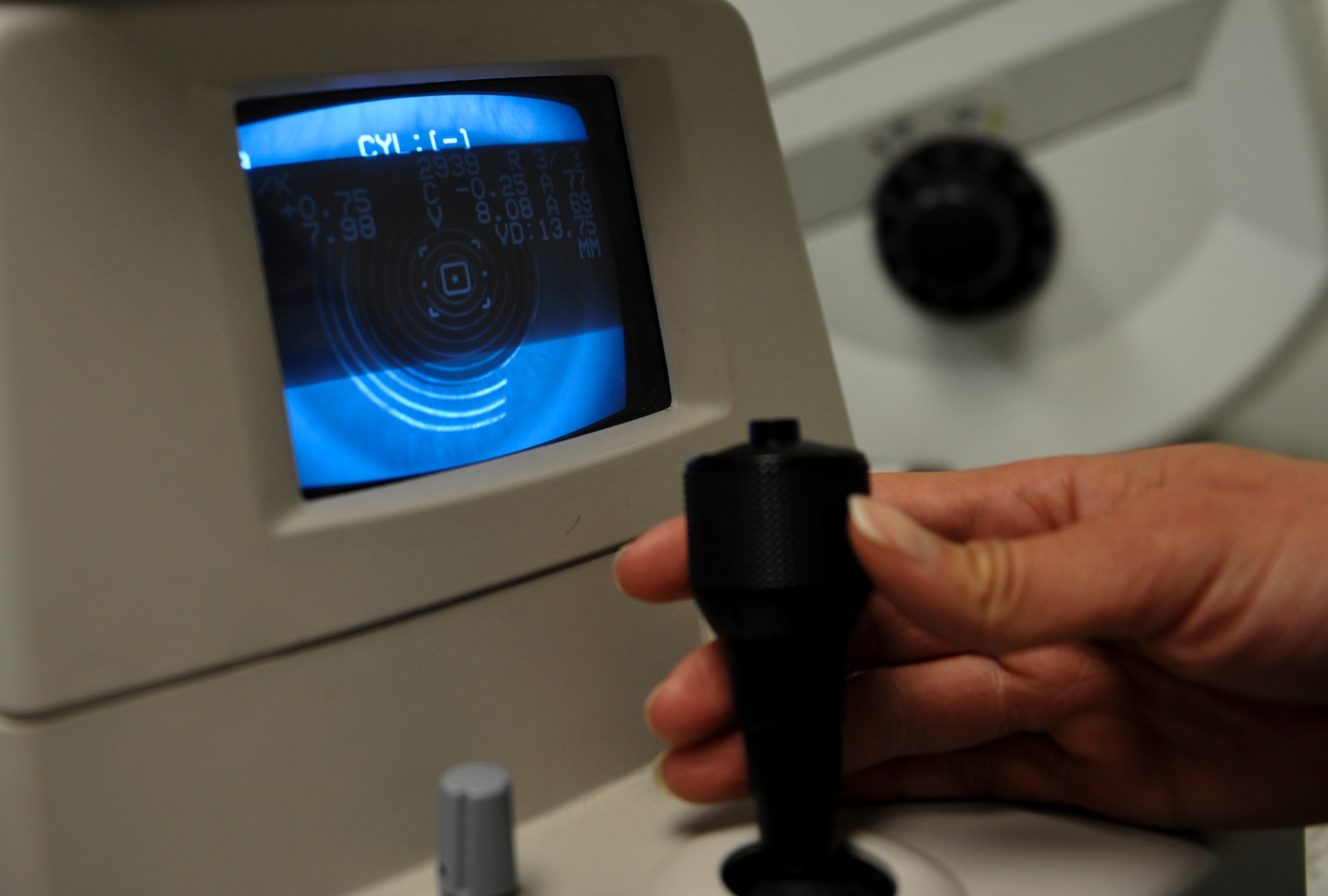 U.S. Air Force Senior Airman Kiara Warren, 51st Aerospace Medicine Squadron optometry technician, operates the auto refractometer machine at Kunsan Air Base, Republic of Korea, March 24, 2017. The auto refractometer measures the curvature of the eye and allows a scan to give a baseline prescription for eyes. (U.S. Air Force photo by Senior Airman Colville McFee/Released)