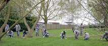 U.S. Air Force and Air Force Reserve Airmen form a line and make details of the surrounding area during the aircraft crash response/search and recovery training April 7, 2017, on RAF Lakenheath, England. Airmen from RAF Mildenhall, RAF Lakenheath and the 927th Force Support Squadron, MacDill Air Force Base, Fla., participated in the training to educate and expose them to one of the critical and difficult tasks they may be asked to support in their careers. (U.S. Air Force photo by Karen Abeyasekere)