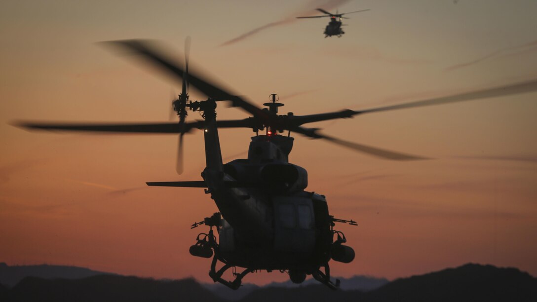 U.S. Marine Corps UH-1Y Venoms assigned to Marine Aviation Weapons and Tactics Squadron One depart after inserting U.S. Marines with 2nd Battalion, 6th Marine Regiment into the objective area during a heavy huey raid as part of Weapons and Tactics Instructor Course 2-17 at Yuma Proving Grounds, Ariz., April 12, 2017. The exercise was designed to focus on executing a company air assault raid supported by fixed wing and rotary wing escort, and simulated aviation delivered fires. WTI is a seven-week training event hosted by MAWTS-1 cadre, which emphasizes operational integration of the six functions of Marine Corps aviation in support of a Marine Air Ground Task Force and provides standardized advanced tactical training and certification of unit instructor qualifications to support Marine Aviation Training and Readiness and assists in developing and employing aviation weapons and tactics.