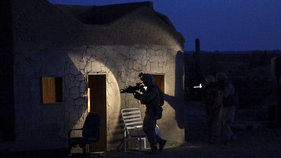 U.S. Marines with 2nd Battalion, 6th Marine Regiment conduct room clearing drills during a heavy huey raid as part of Weapons and Tactics Instructor Course 2-17 at Yuma Proving Grounds, Ariz., April 12, 2017. The exercise was designed to focus on executing a company air assault raid supported by fixed wing and rotary wing escort, and simulated aviation delivered fires. WTI is a seven-week training event hosted by MAWTS-1 cadre, which emphasizes operational integration of the six functions of Marine Corps aviation in support of a Marine Air Ground Task Force and provides standardized advanced tactical training and certification of unit instructor qualifications to support Marine Aviation Training and Readiness and assists in developing and employing aviation weapons and tactics.