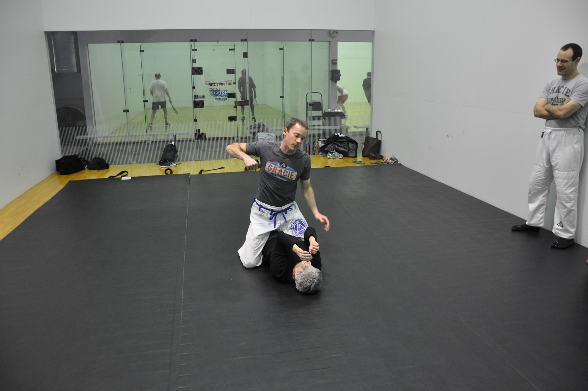 Cindy Hunt (bottom) an administrative assistant in the Air Force Research Laboratory’s Aerospace Systems Directorate practices a self-defense technique with Jesse Brand, one of the class instructors. (U.S. Air Force photo / Brian Brackens)
